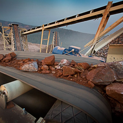 Why is a belt scraper important?